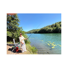 Frau mit Rute Familienangeln
